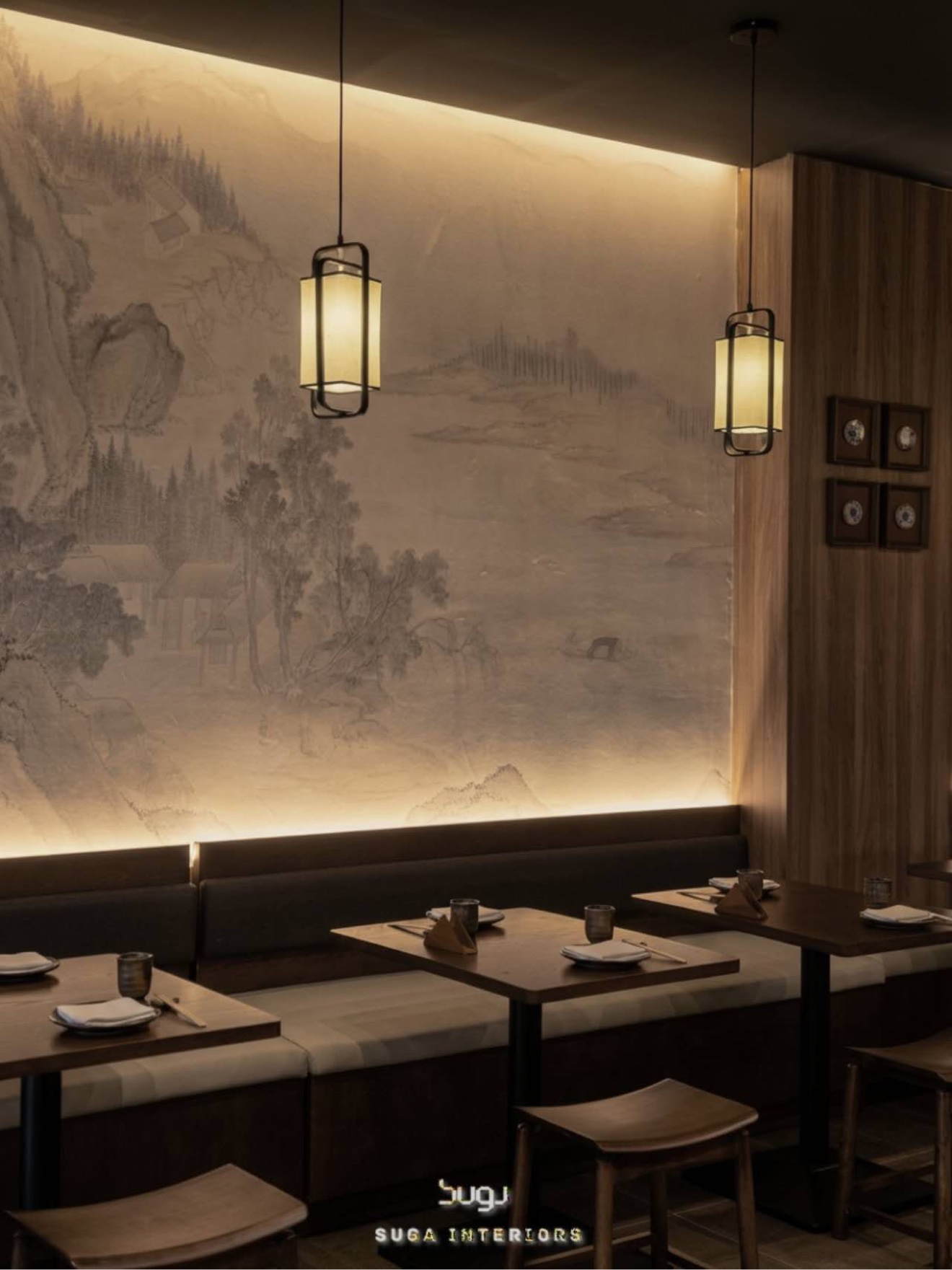 Finished dessert shop interior with warm lighting and dark wood seating